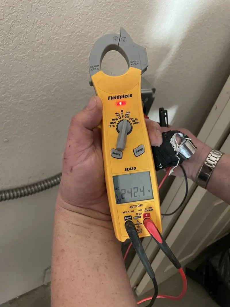 Voltage testing with clamp meter during Recessed Lighting Installation in Gardner